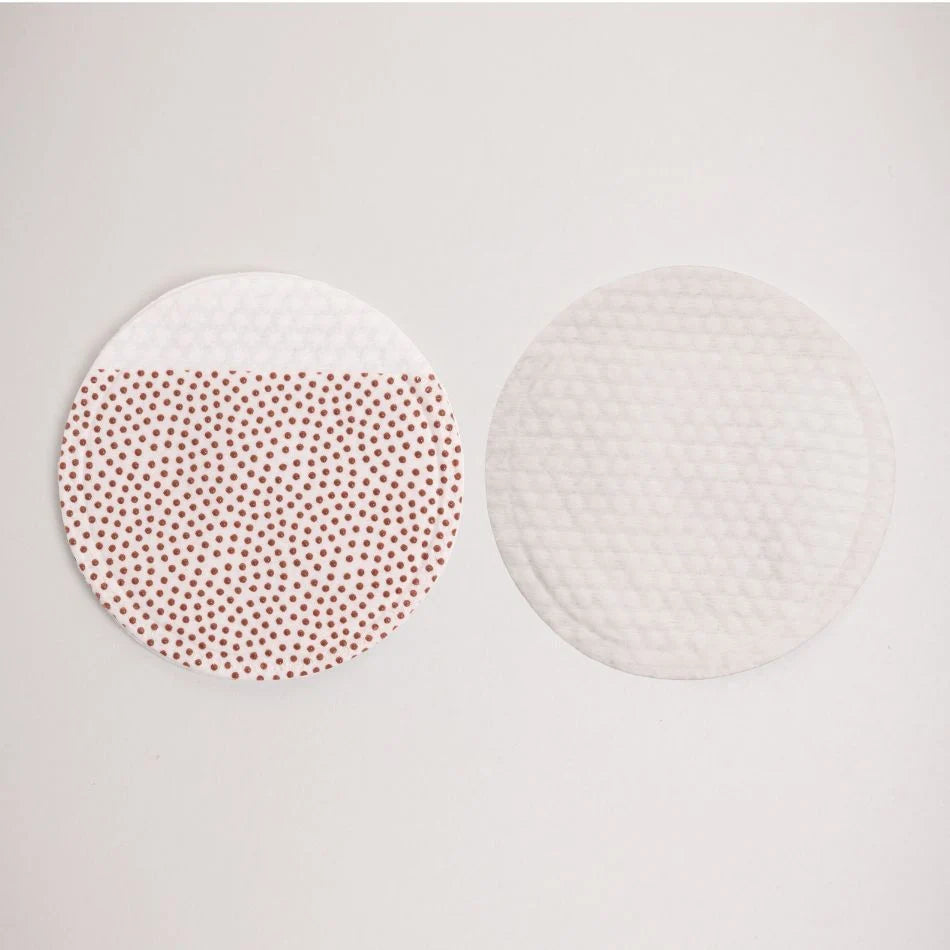 The Prep Pads being used on skin, textured silicone side prepping the complexion