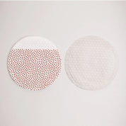 The Prep Pads being used on skin, textured silicone side prepping the complexion